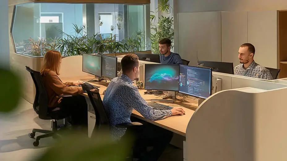 Team working at computers in modern office
