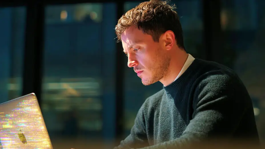Man working on laptop in office